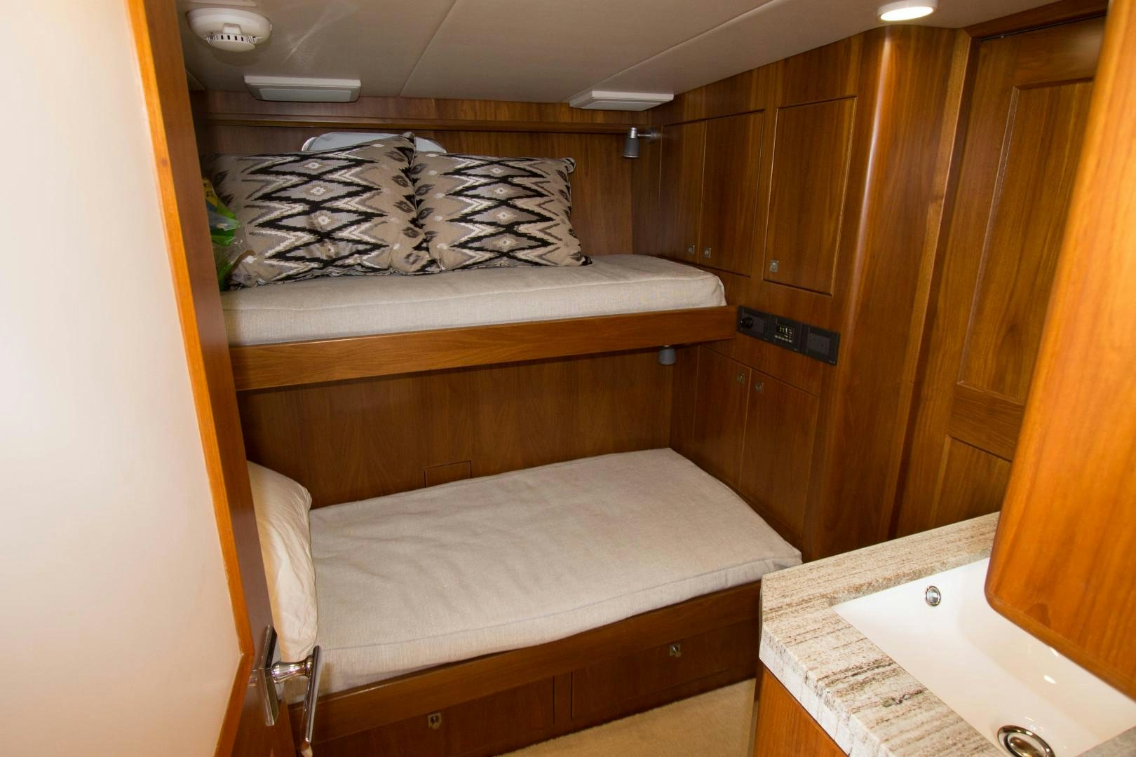a couple of beds in a room aboard LET IT BEE Yacht for Sale