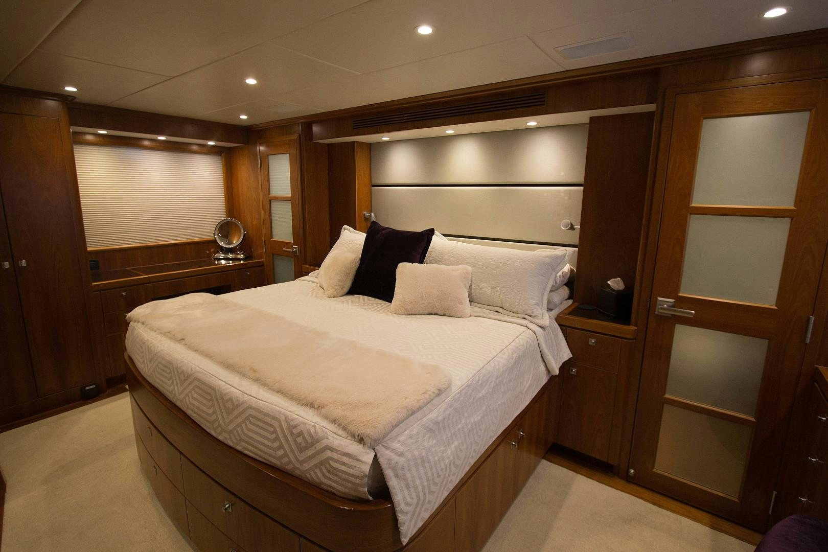 a bed in a room aboard LET IT BEE Yacht for Sale