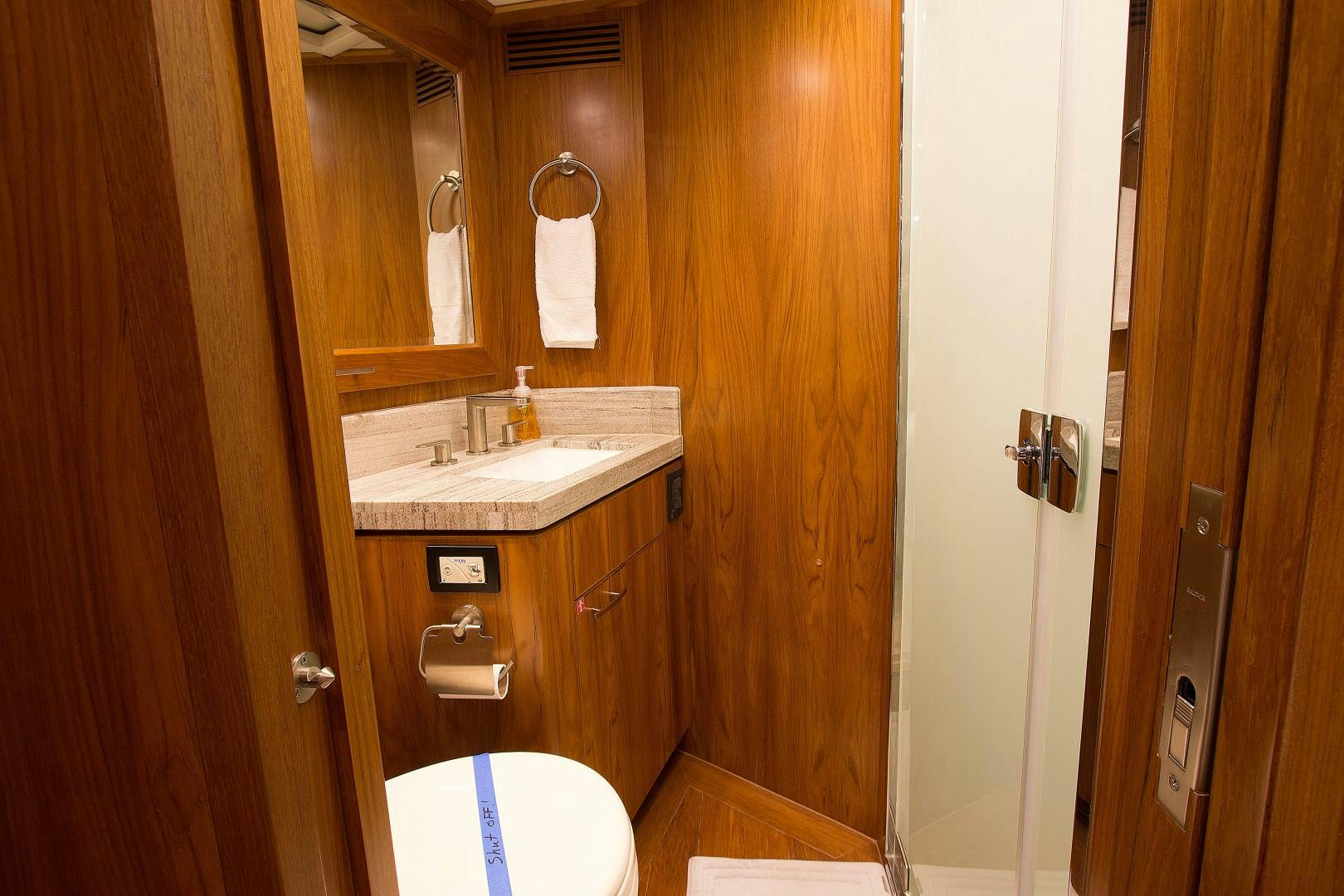 a bathroom with a sink and toilet aboard LET IT BEE Yacht for Sale