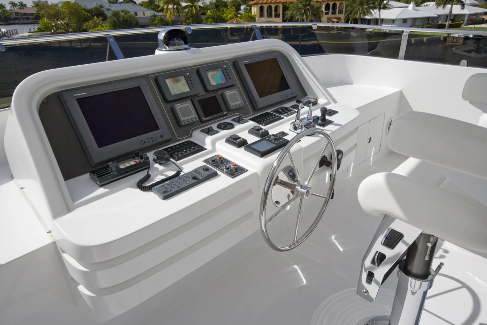 a white car with a screen and a computer on the hood aboard SANDRINE Yacht for Sale