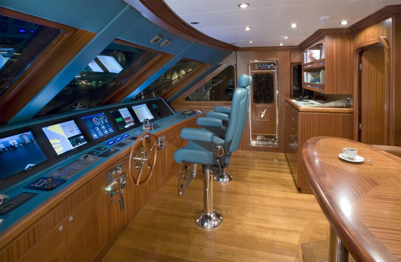a room with a desk and chairs aboard SANDRINE Yacht for Sale