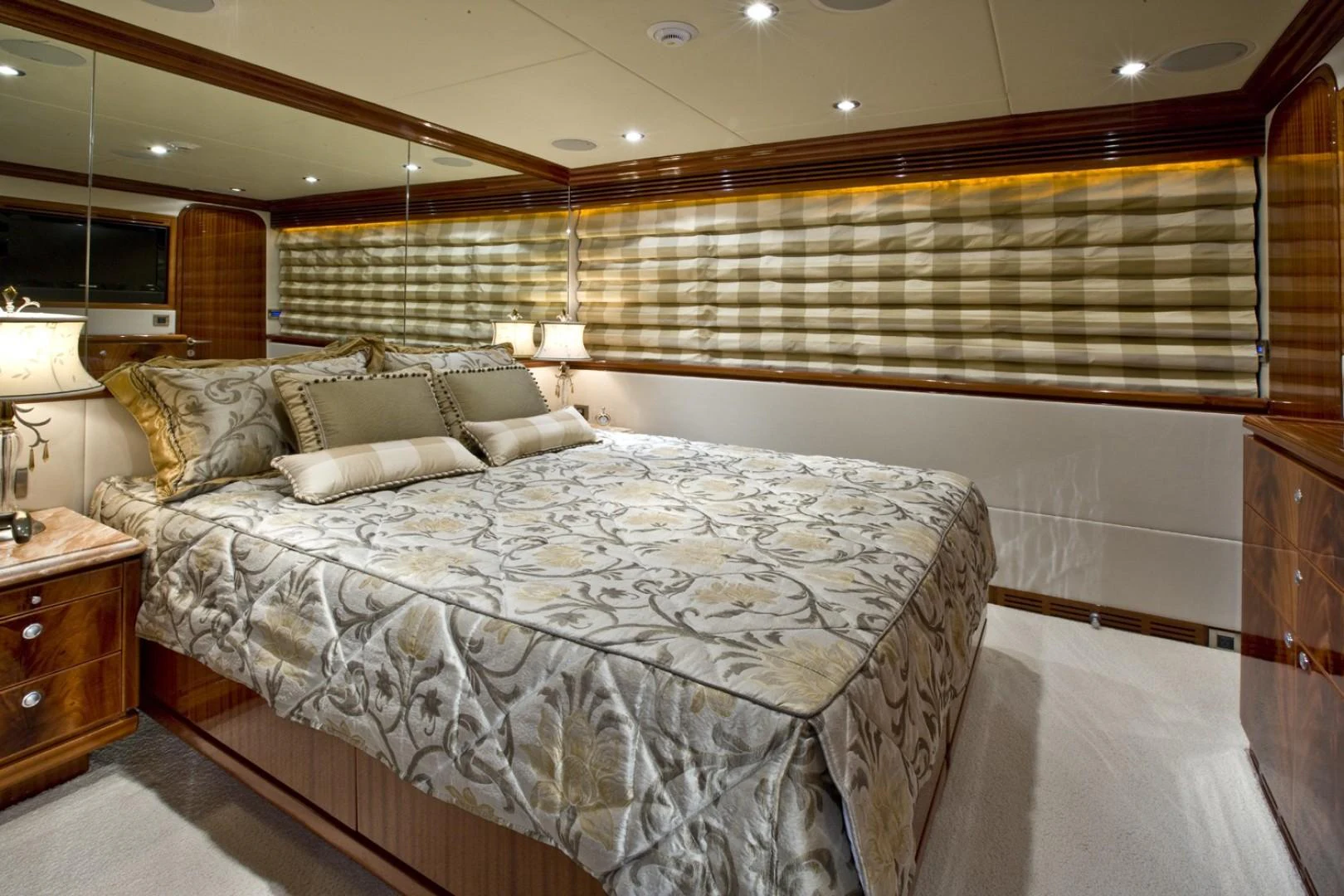 a room with a bed and a lamp aboard SANDRINE Yacht for Sale