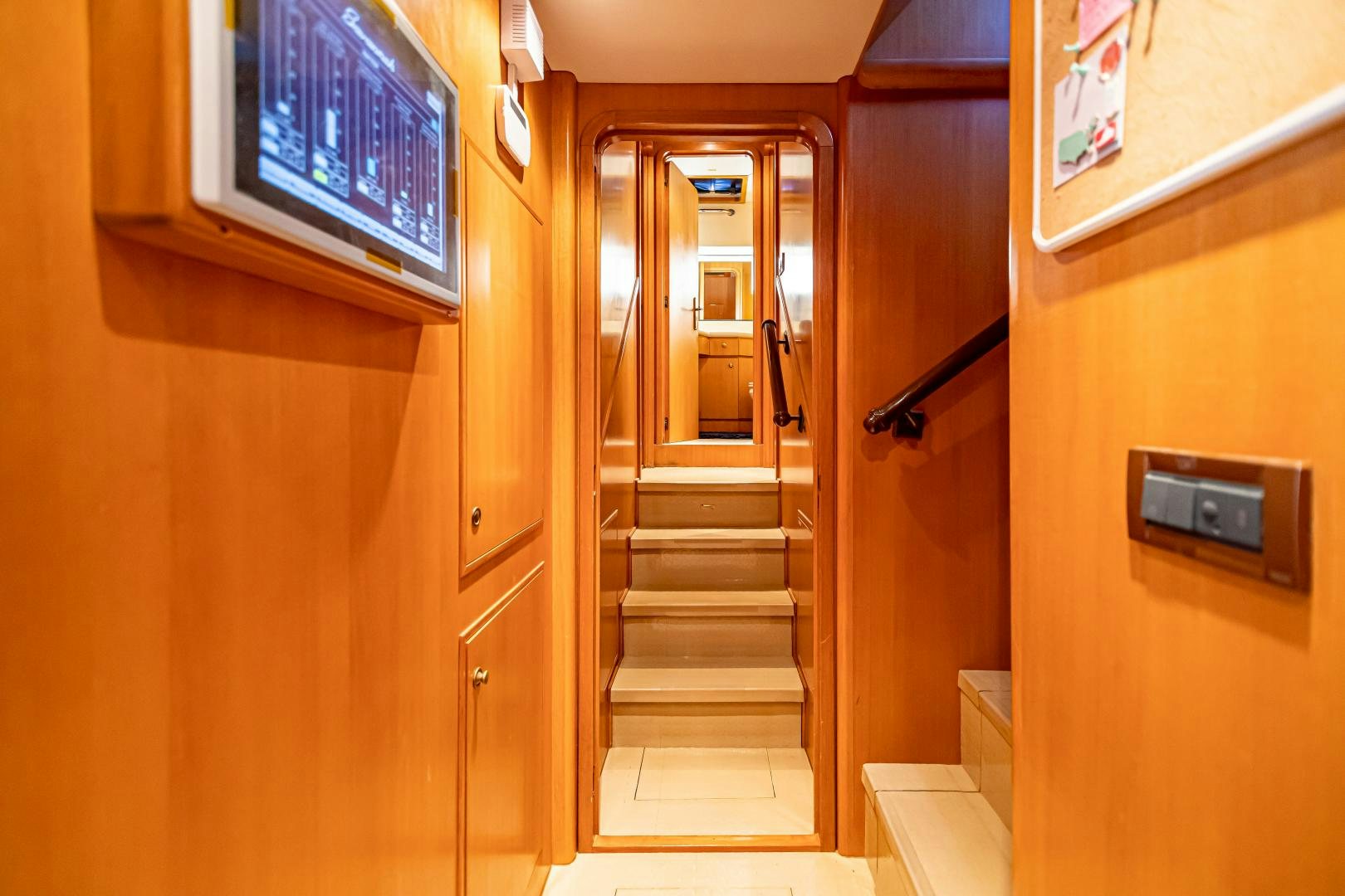 a hallway with a door aboard XOXO Yacht for Sale