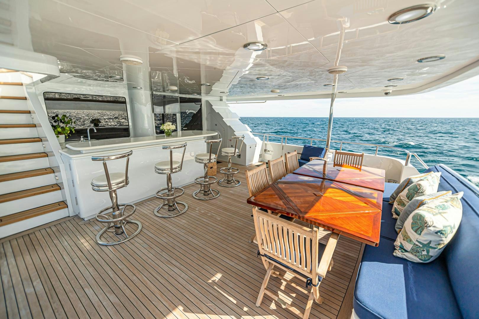 a room with a table and chairs aboard XOXO Yacht for Sale