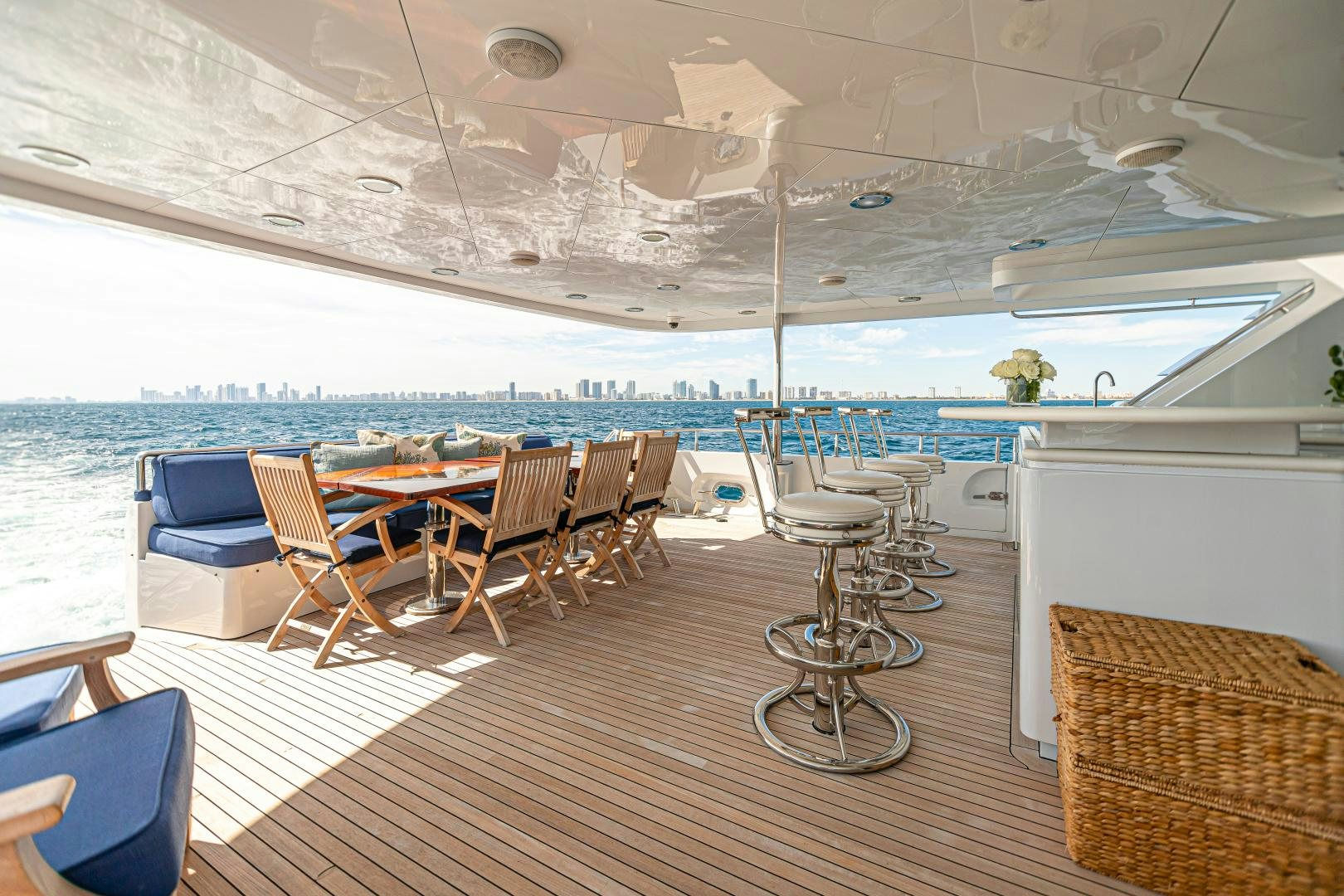 a room with a table and chairs aboard XOXO Yacht for Sale