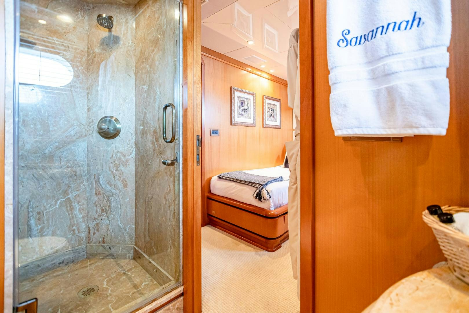 a bathroom with a shower and a sink aboard XOXO Yacht for Sale