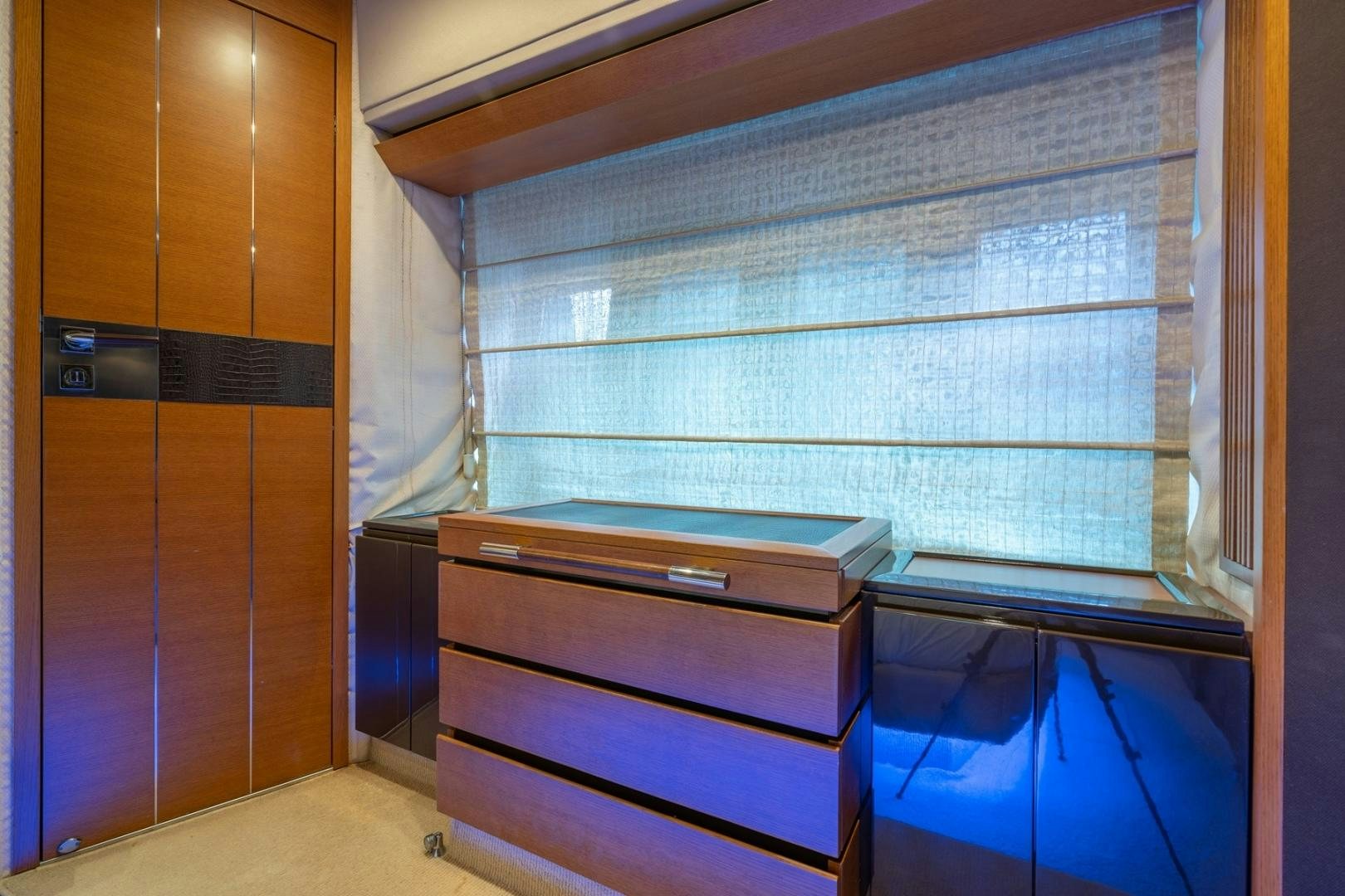 a room with a dresser and a window aboard SYLVIA VI Yacht for Sale
