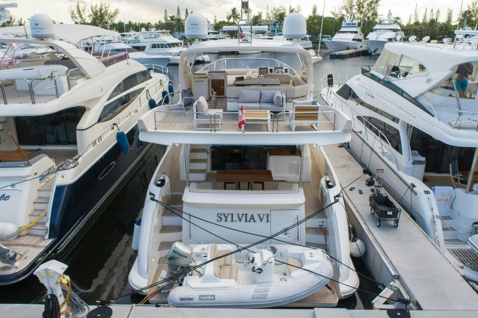 a group of boats are parked in a harbor aboard SYLVIA VI Yacht for Sale