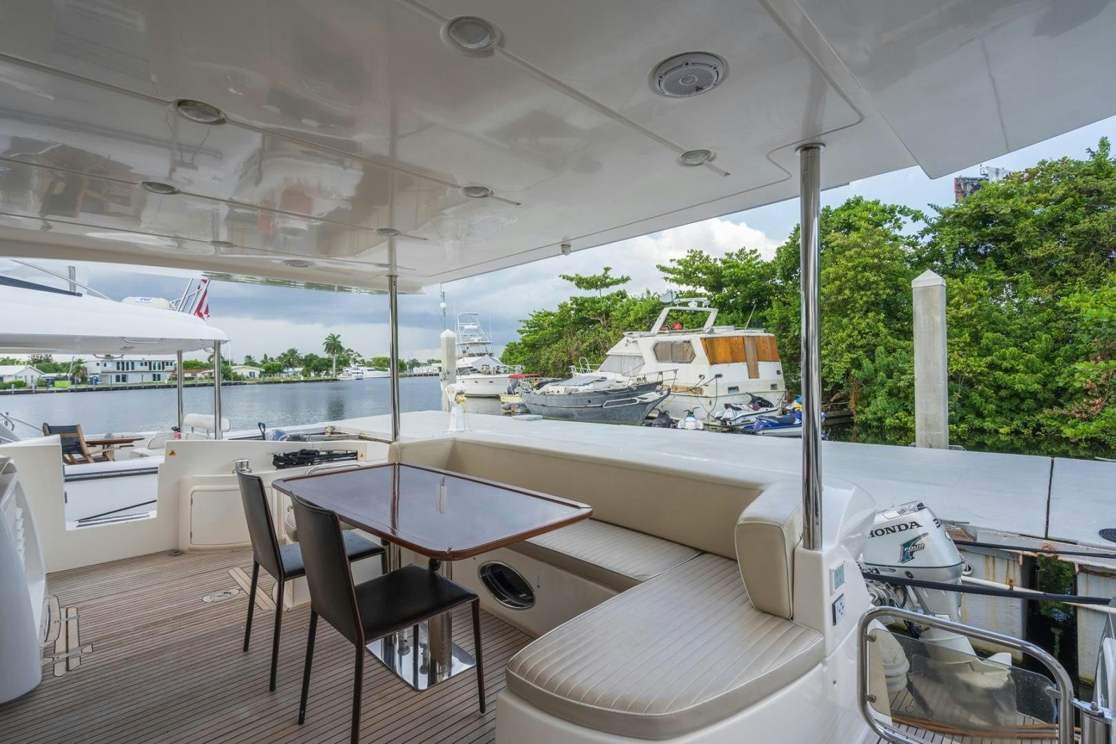 a room with a table and chairs aboard SYLVIA VI Yacht for Sale