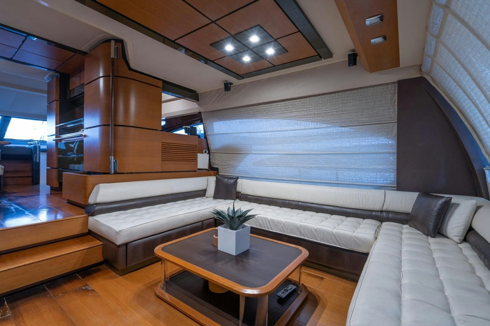 a room with couches and a coffee table aboard SYLVIA VI Yacht for Sale