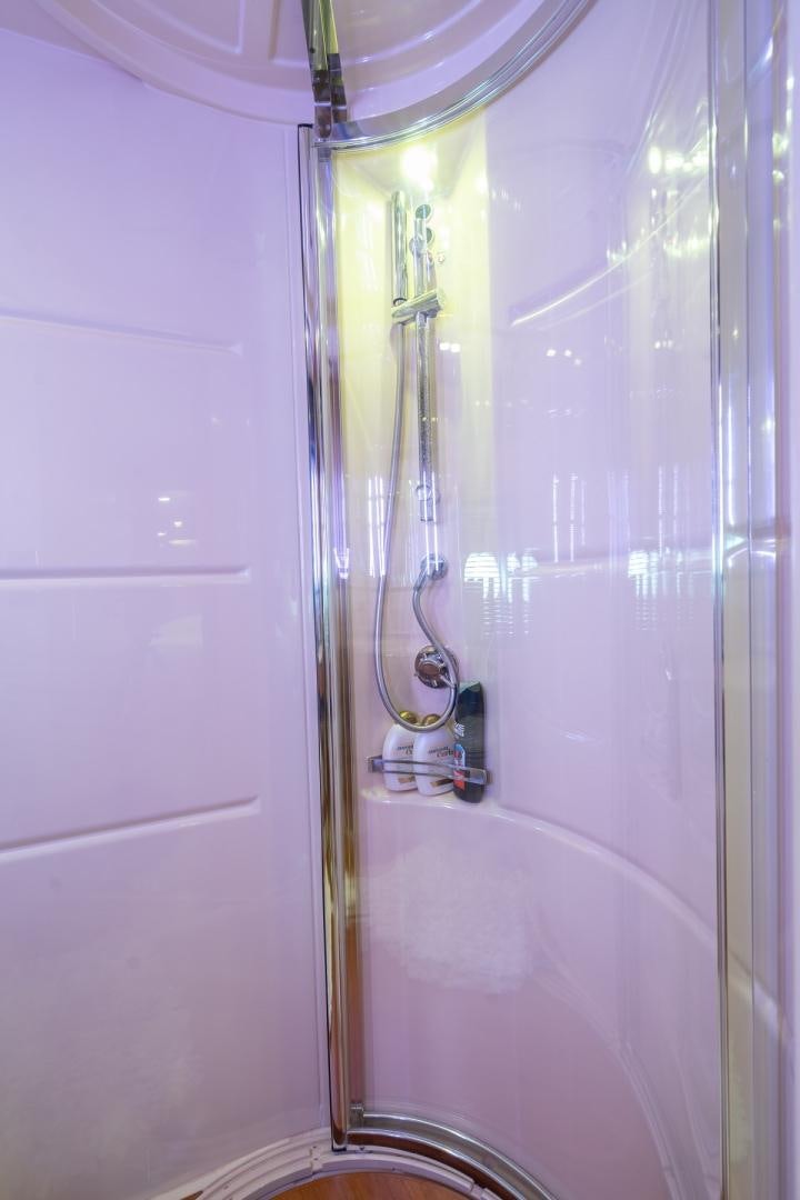 a shower with a glass door aboard SYLVIA VI Yacht for Sale