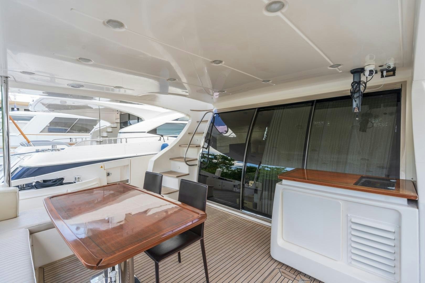 a room with a table and chairs aboard SYLVIA VI Yacht for Sale