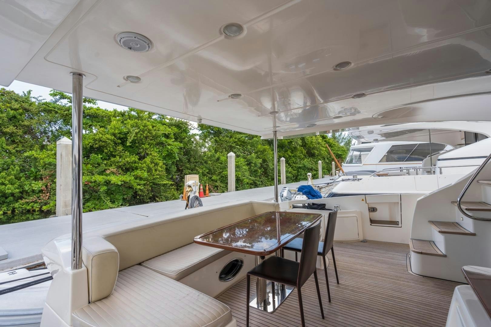 a room with a table and chairs aboard SYLVIA VI Yacht for Sale