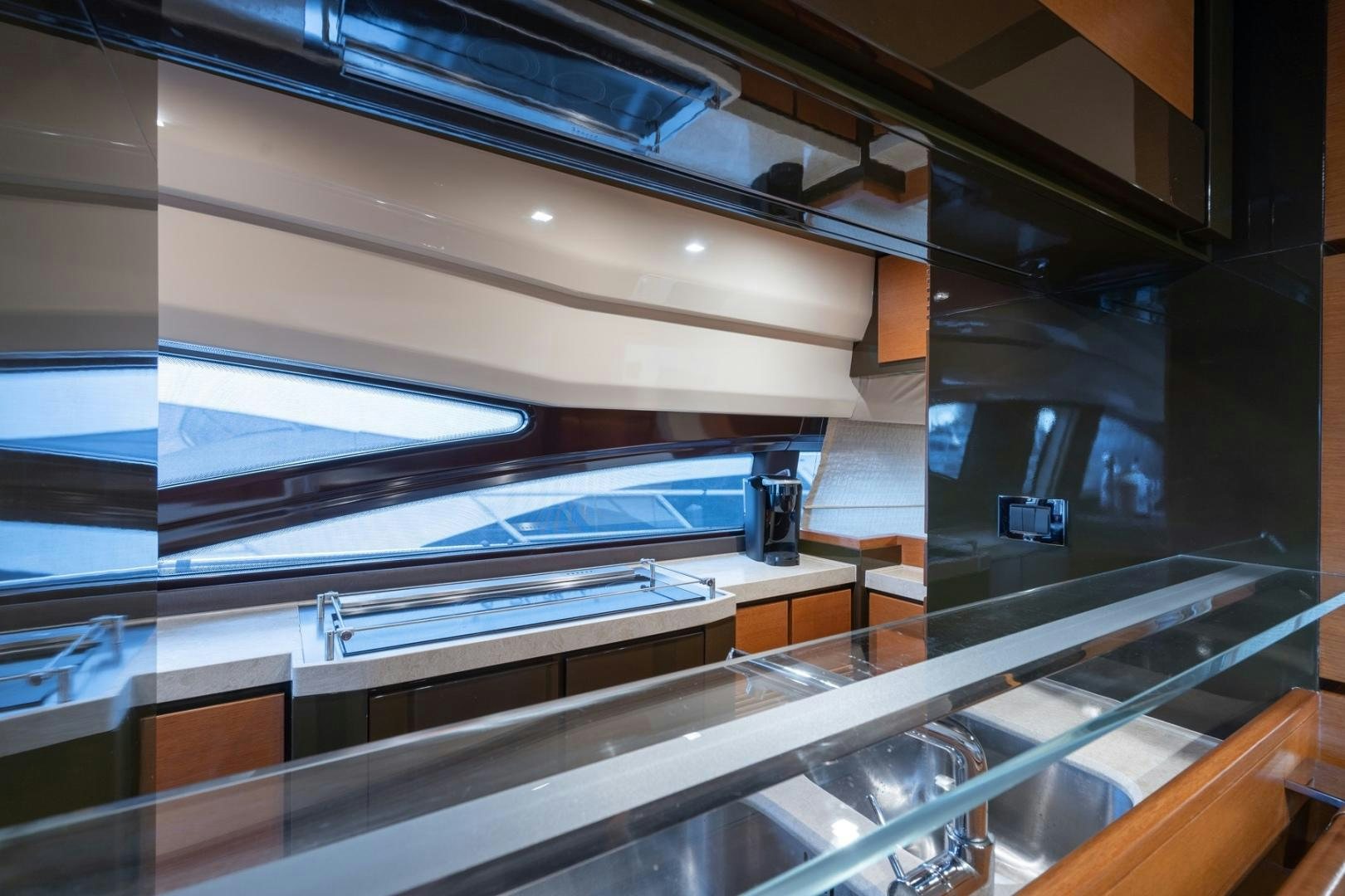 a large room with glass walls aboard SYLVIA VI Yacht for Sale