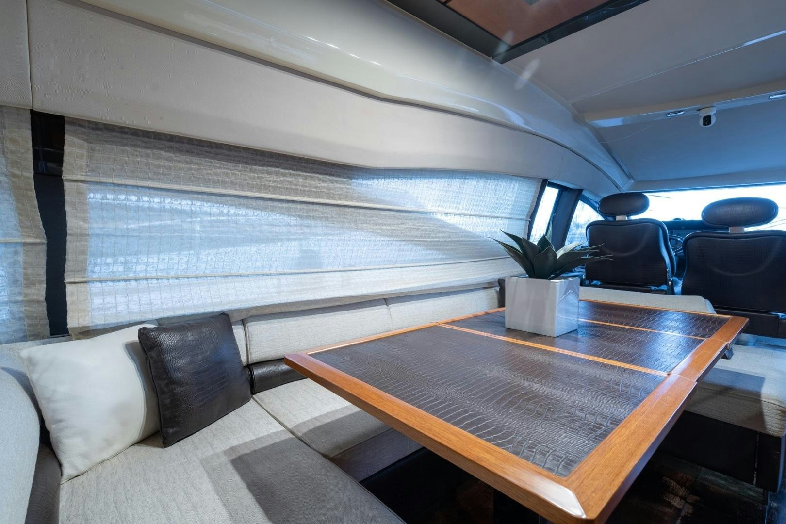 a room with a table and chairs aboard SYLVIA VI Yacht for Sale