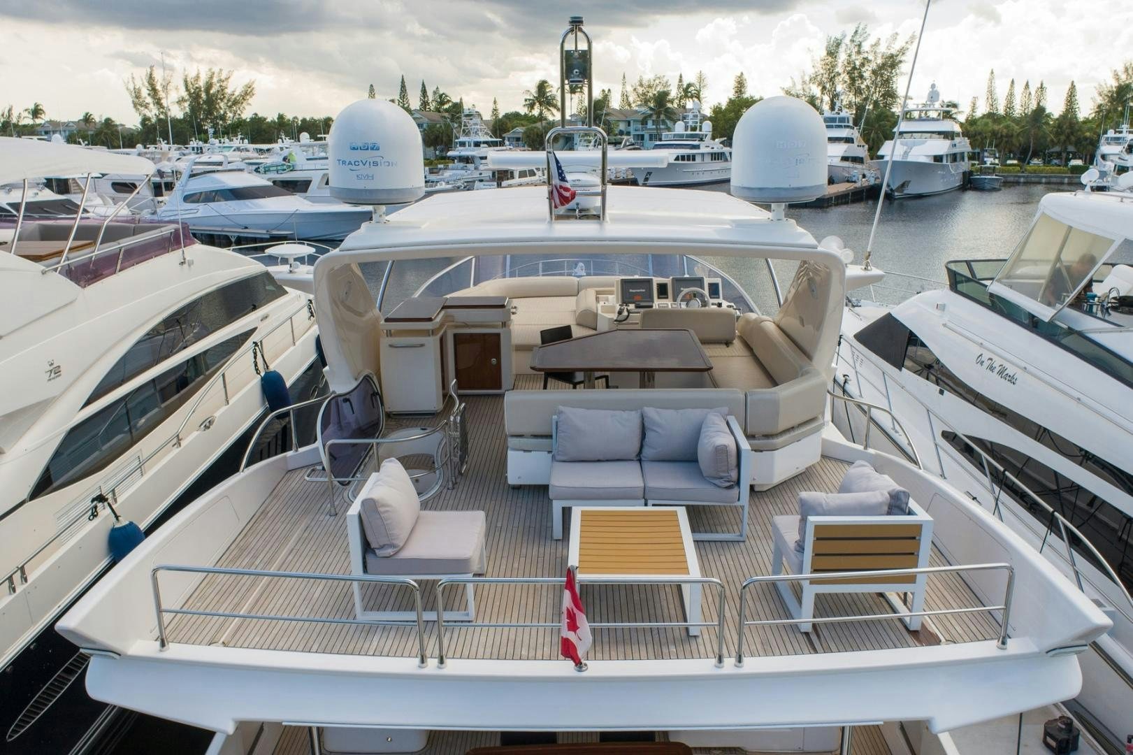 a deck with a boat and a bench on it aboard SYLVIA VI Yacht for Sale