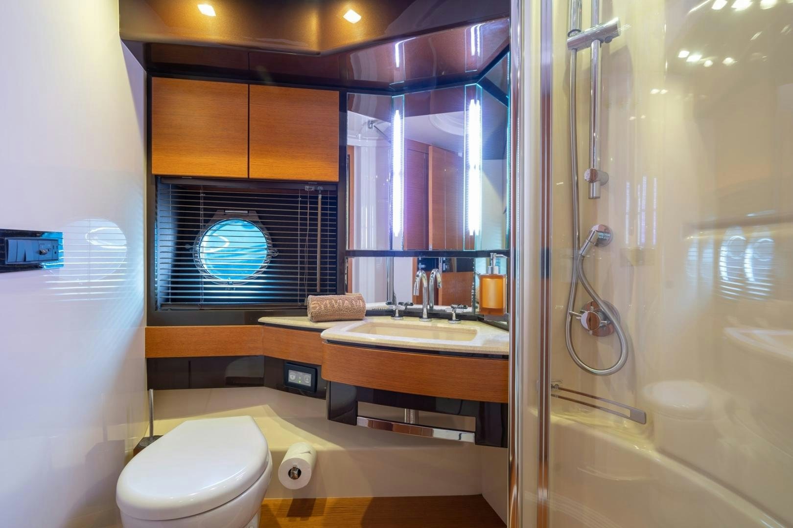 a bathroom with a sink and a toilet aboard SYLVIA VI Yacht for Sale