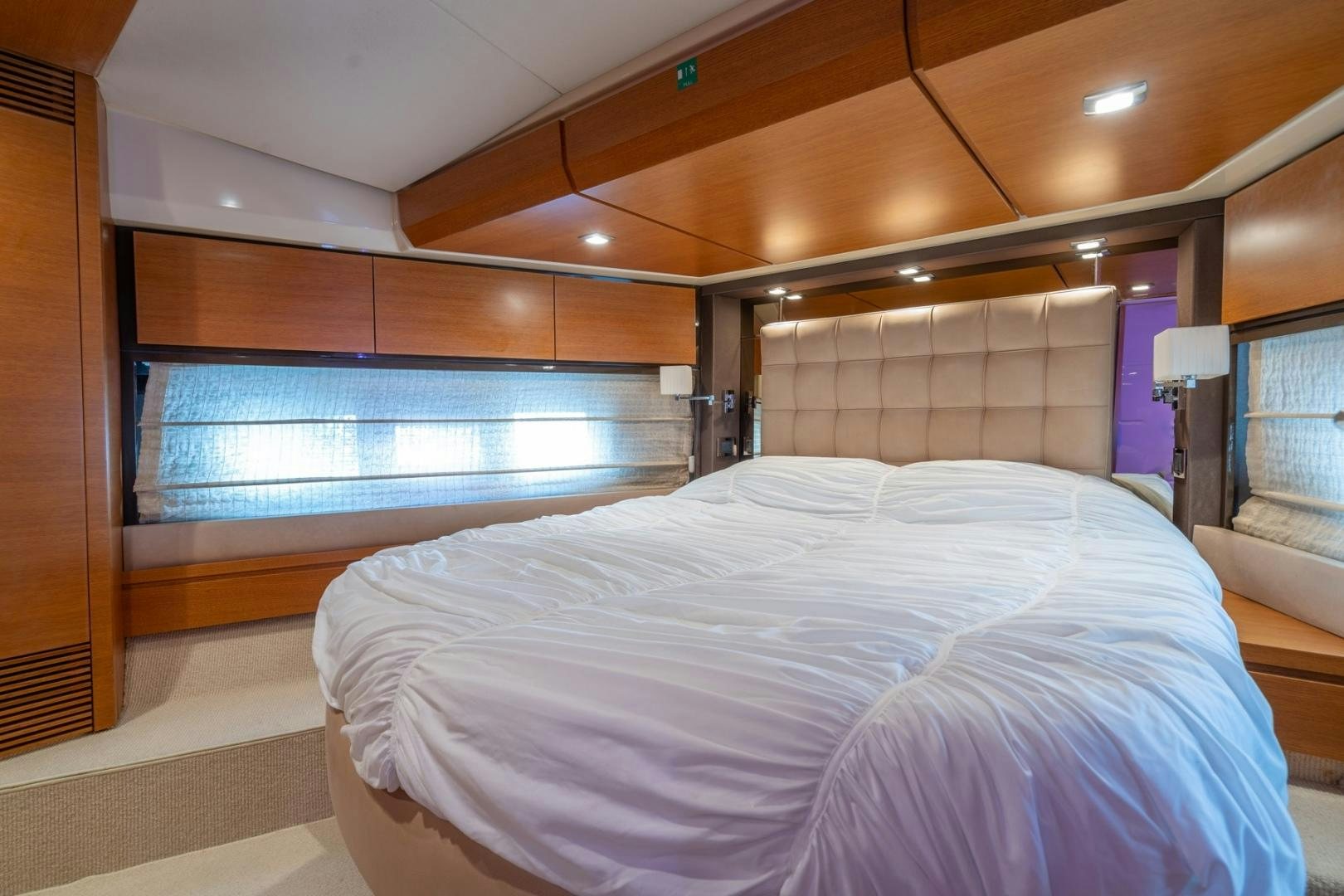 a room with a bed and a window aboard SYLVIA VI Yacht for Sale