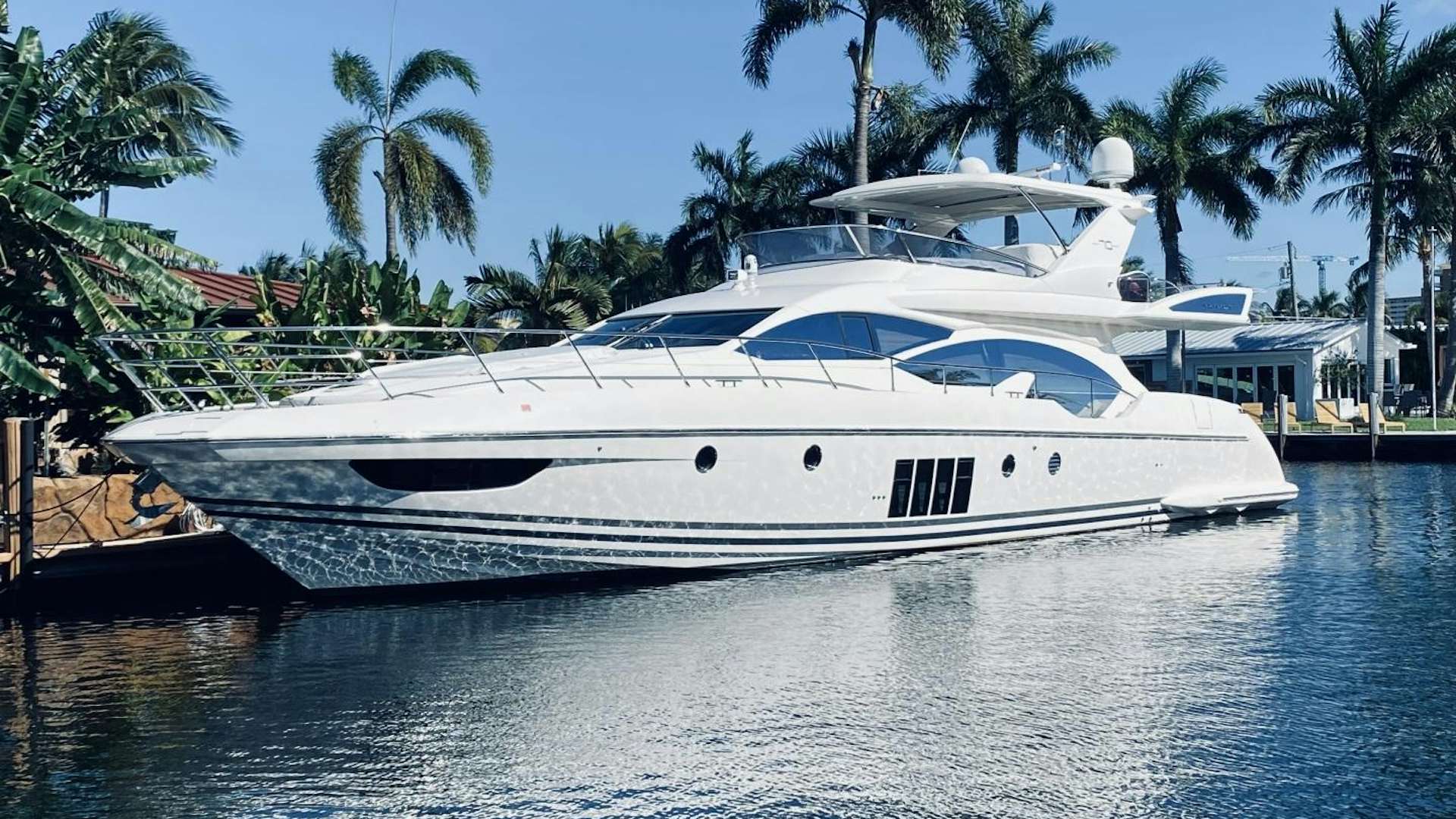 a white yacht in the water aboard SYLVIA VI Yacht for Sale