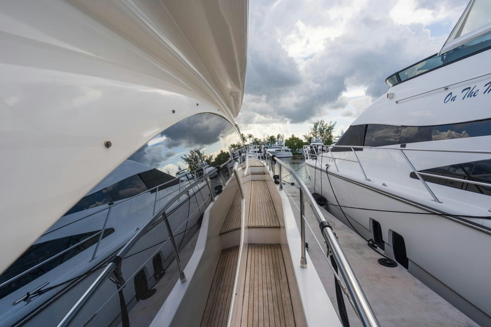 a deck with a couple of boats on it aboard SYLVIA VI Yacht for Sale
