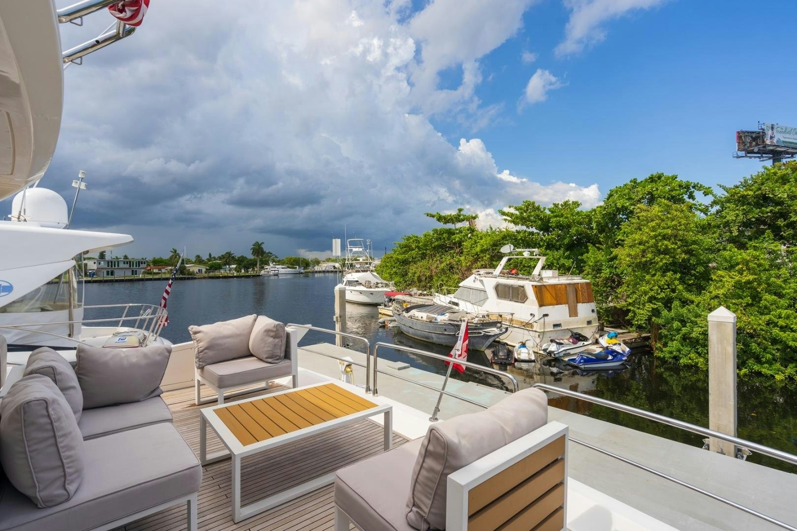 a deck with boats and a chair on it aboard SYLVIA VI Yacht for Sale