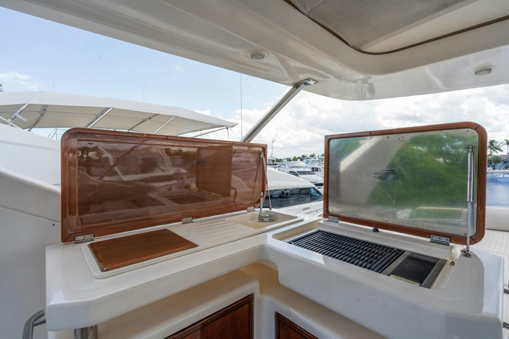 a laptop sits on a table aboard SYLVIA VI Yacht for Sale