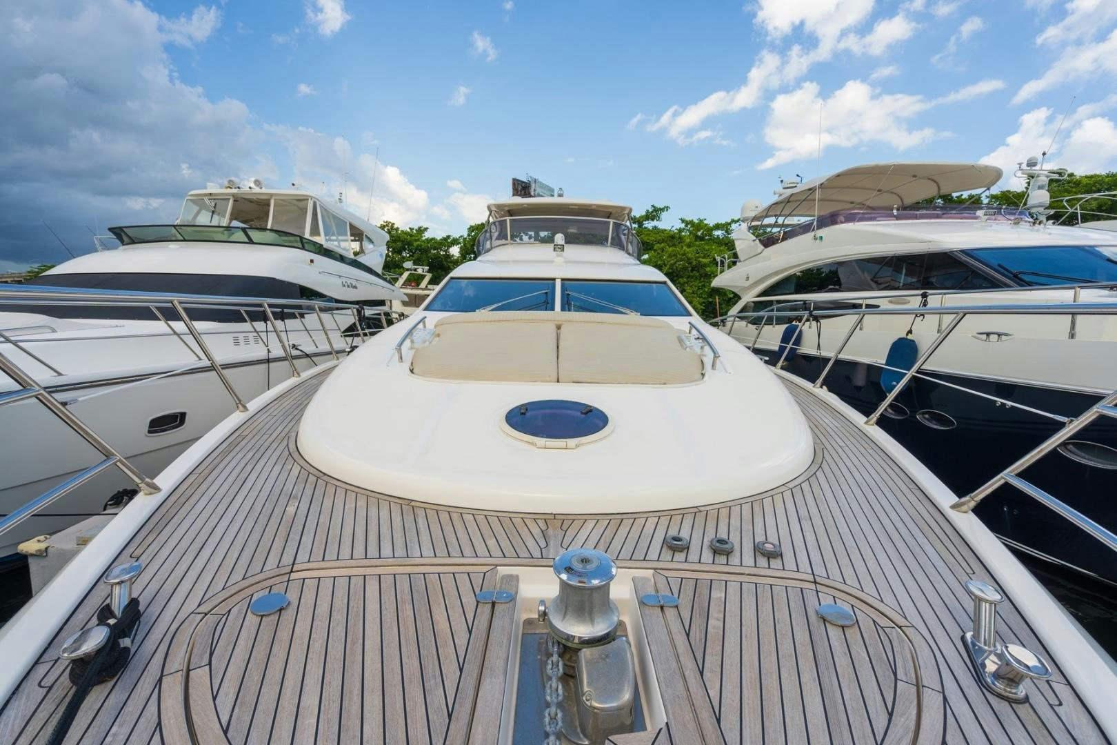 a deck with boats and a water bottle on it aboard SYLVIA VI Yacht for Sale