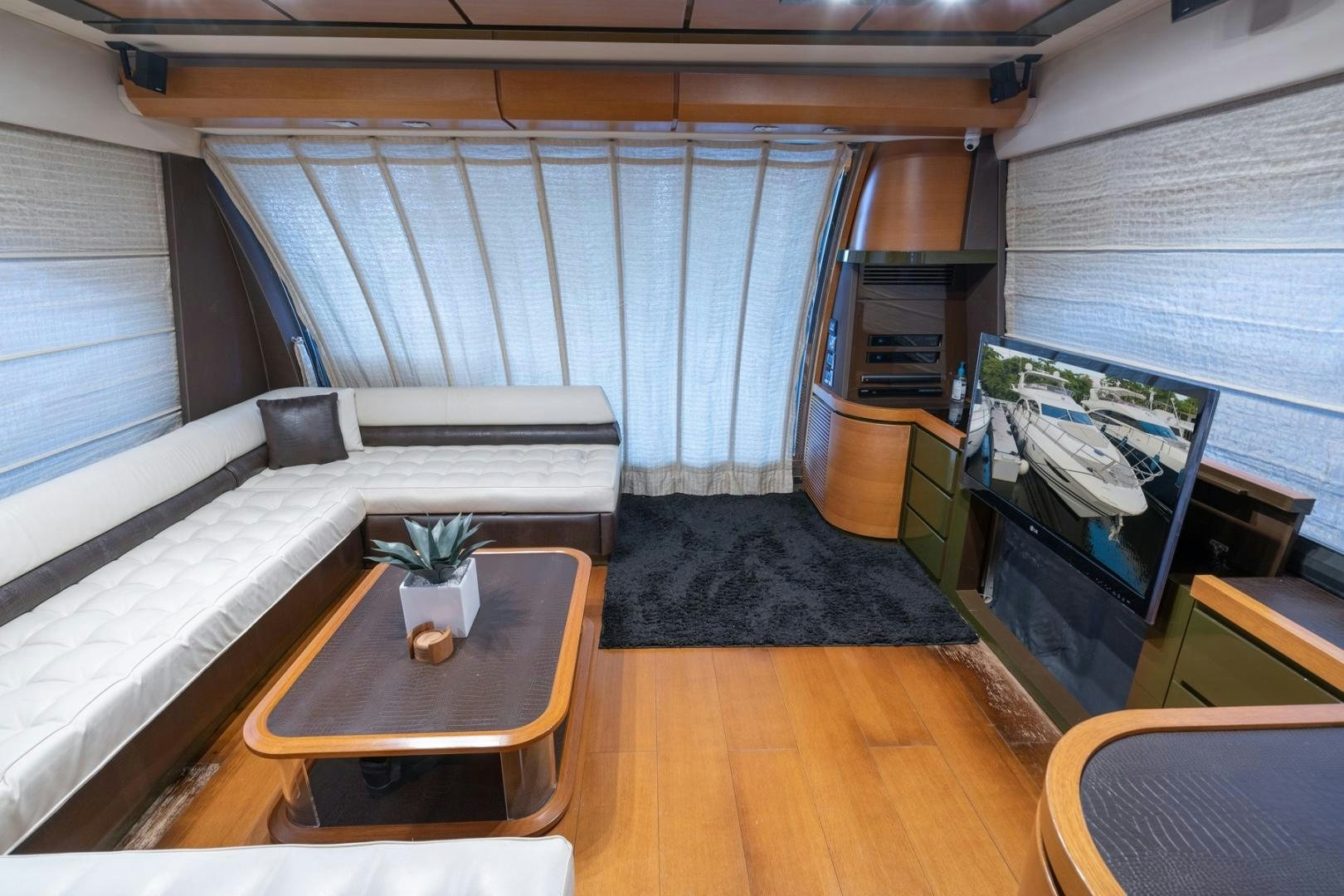 a room with a bed and a table aboard SYLVIA VI Yacht for Sale