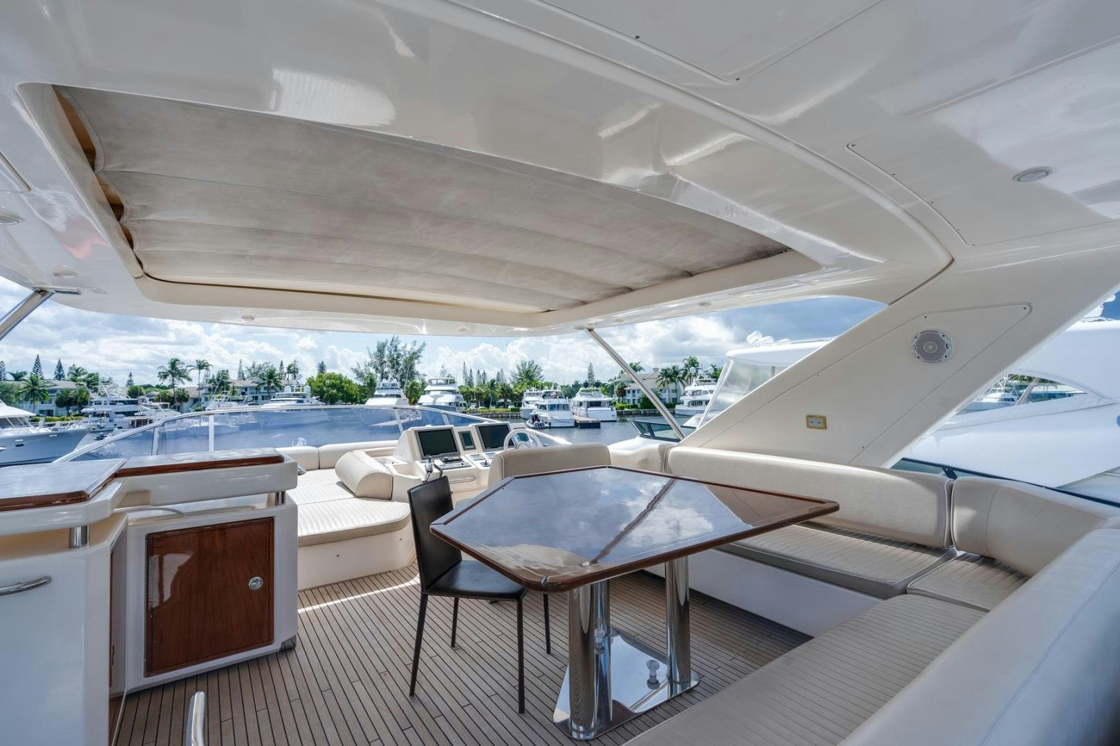 a room with a table and chairs aboard SYLVIA VI Yacht for Sale