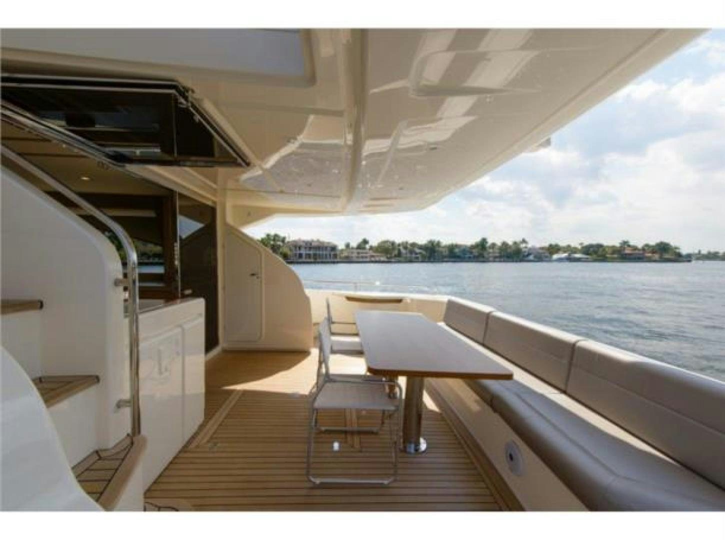 a boat with a table and chairs on it aboard BLUE ABALONE Yacht for Sale