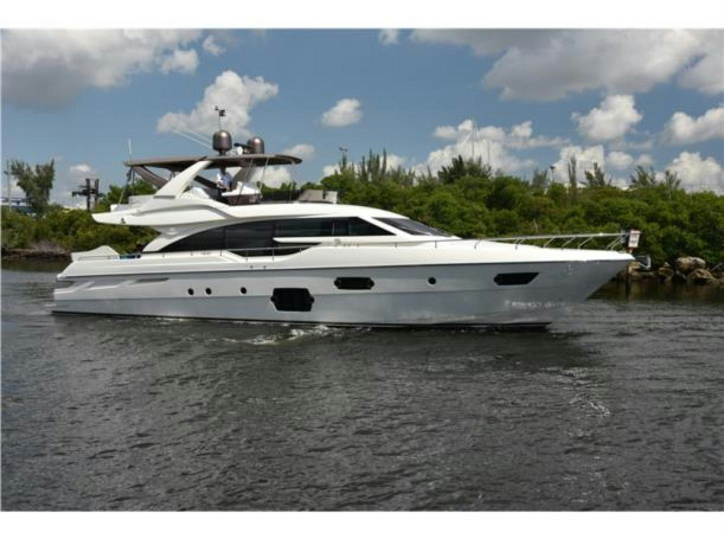 a white yacht in the water aboard BLUE ABALONE Yacht for Sale
