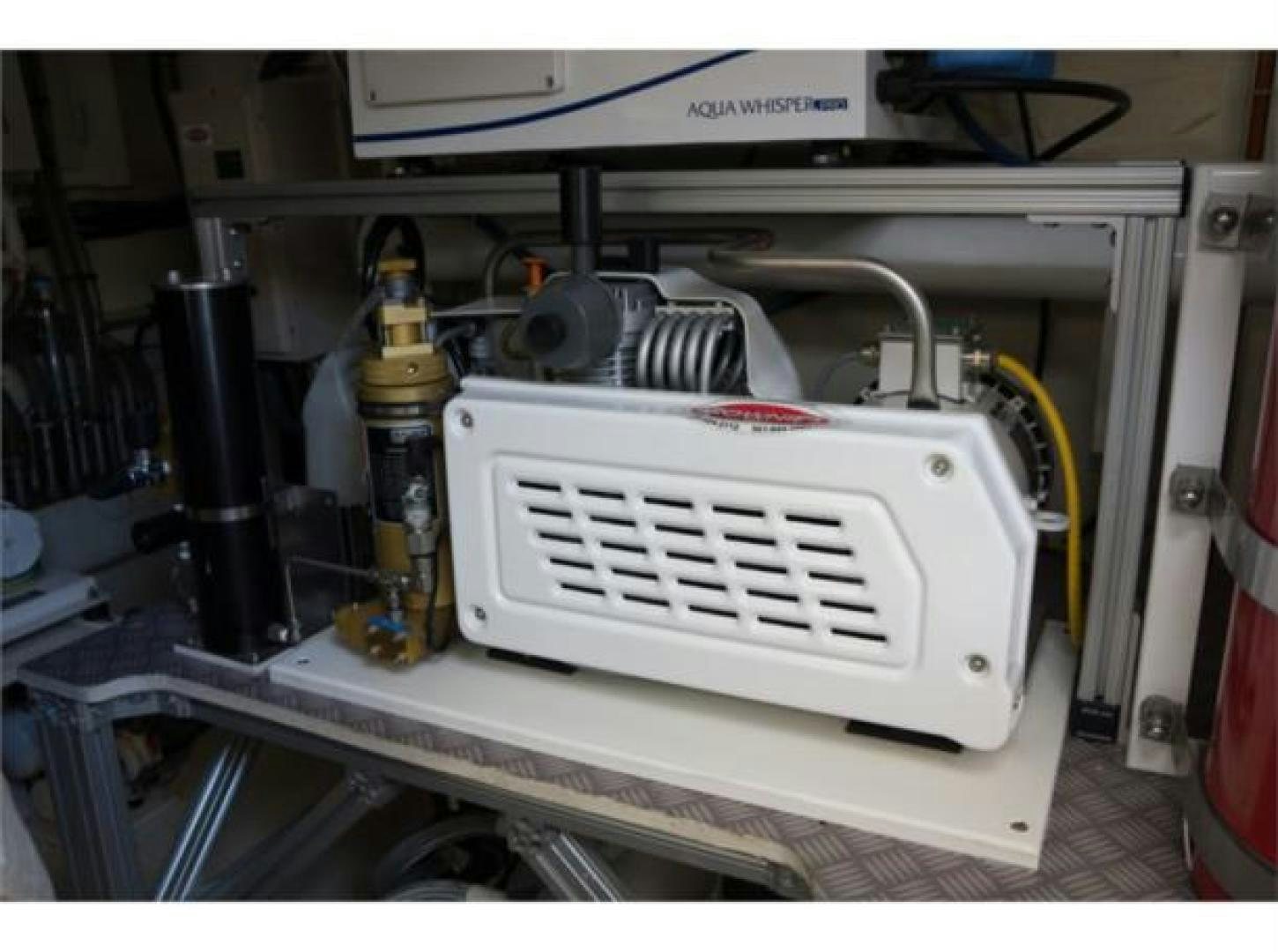 a machine with a large piece of equipment in it aboard BLUE ABALONE Yacht for Sale