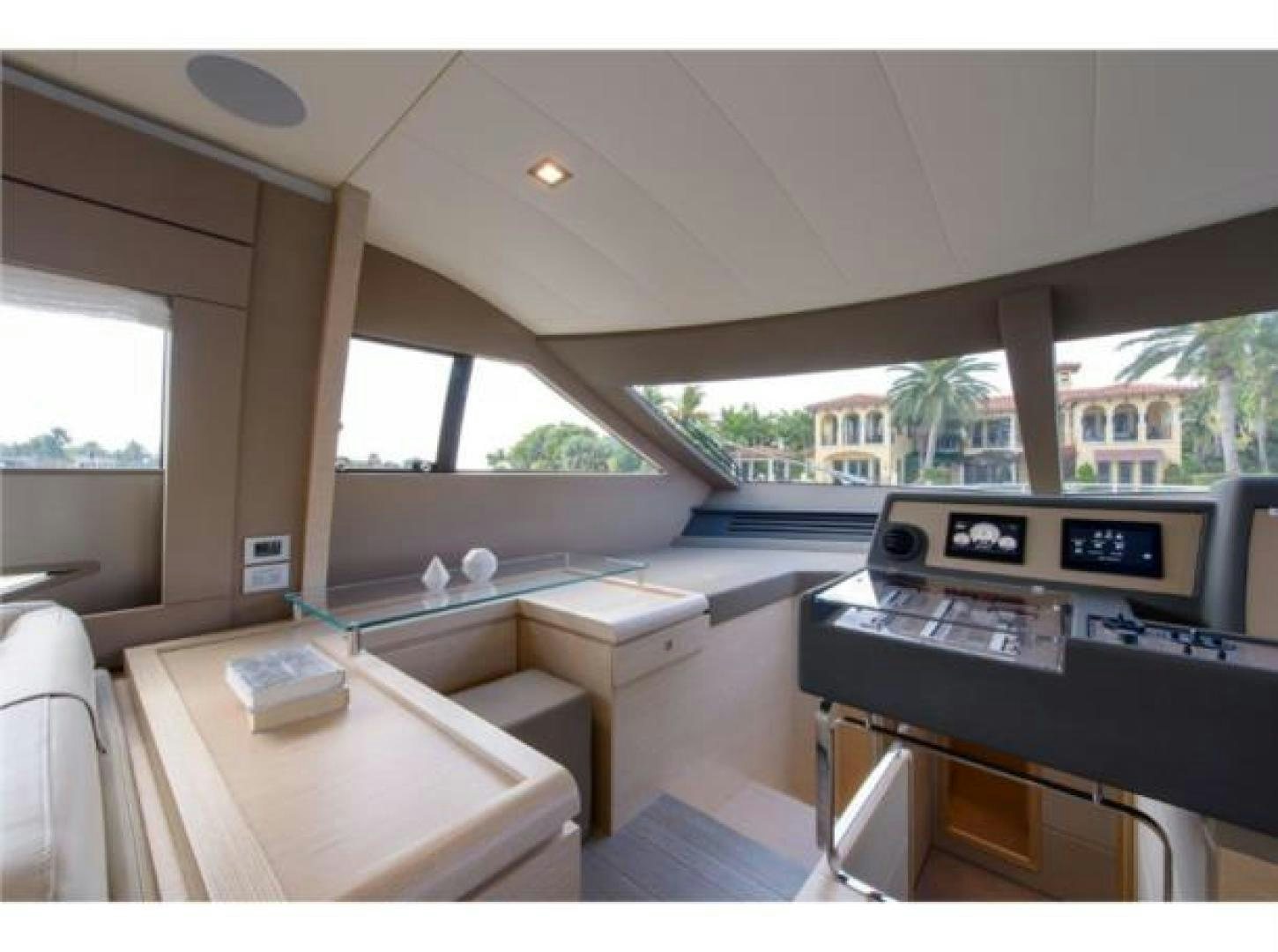 a room with a piano and a table and a window aboard BLUE ABALONE Yacht for Sale