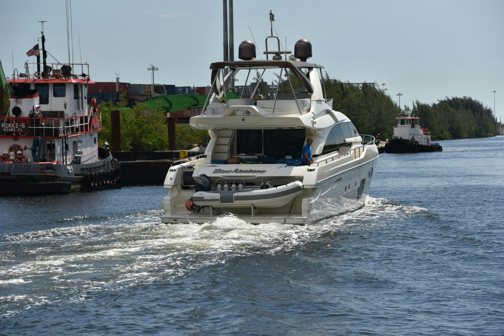 a couple of boats are moving on water aboard BLUE ABALONE Yacht for Sale
