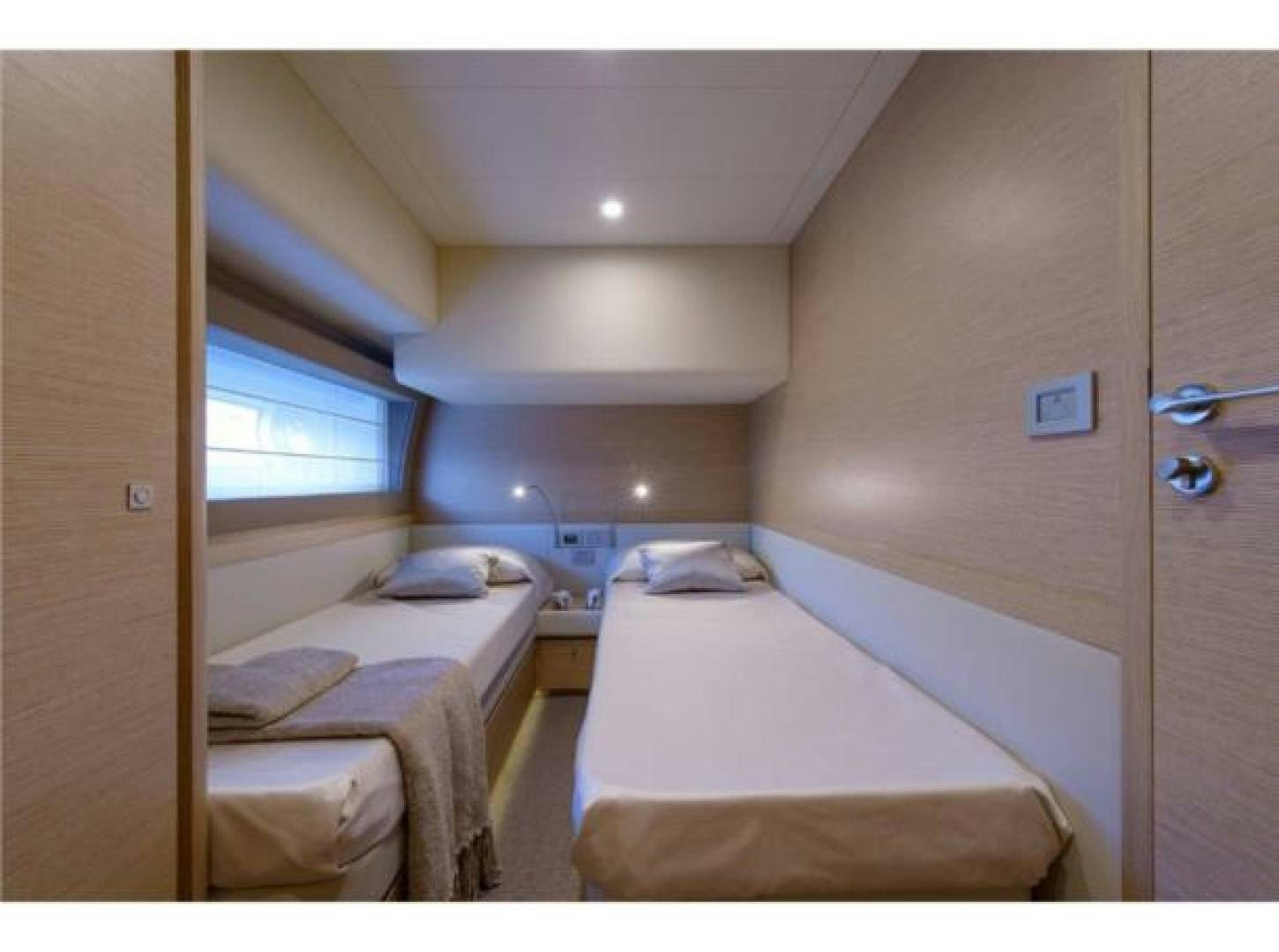 a couple of beds in a room aboard BLUE ABALONE Yacht for Sale