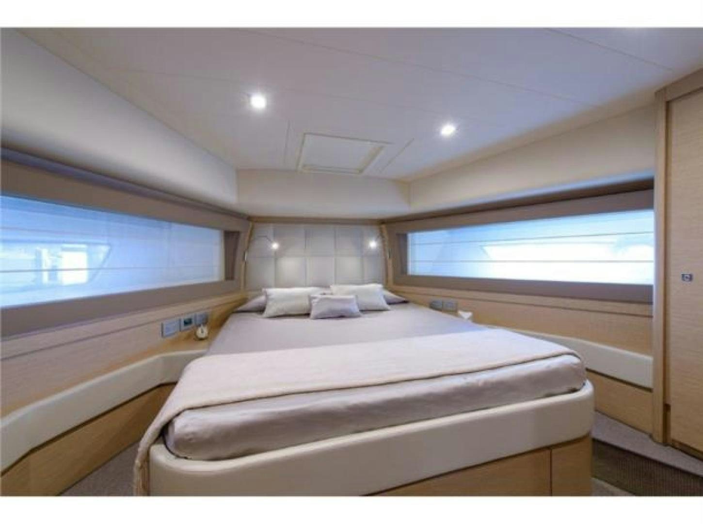 a room with a bed and a window aboard BLUE ABALONE Yacht for Sale