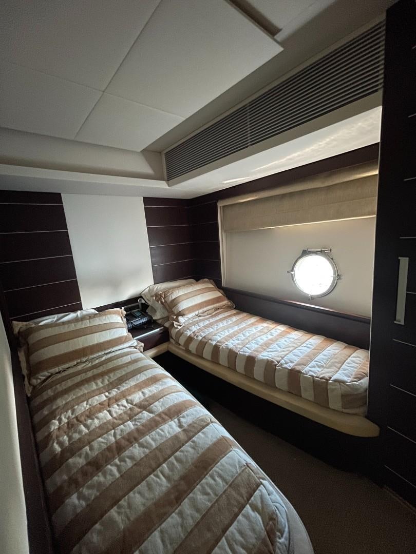 two beds in a room aboard DV8 Yacht for Sale