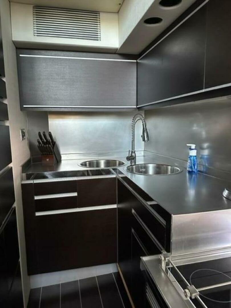 a kitchen with a sink and a faucet aboard DV8 Yacht for Sale