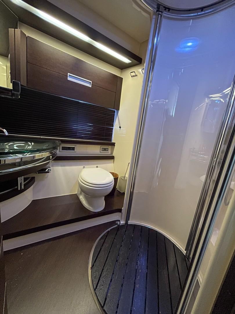 a bathroom with a glass shower aboard DV8 Yacht for Sale