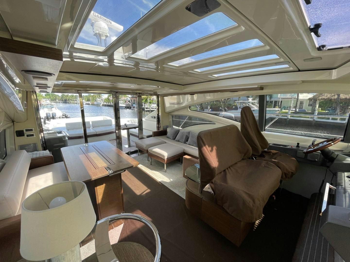 inside of a vehicle with a table and chairs and a large window aboard DV8 Yacht for Sale