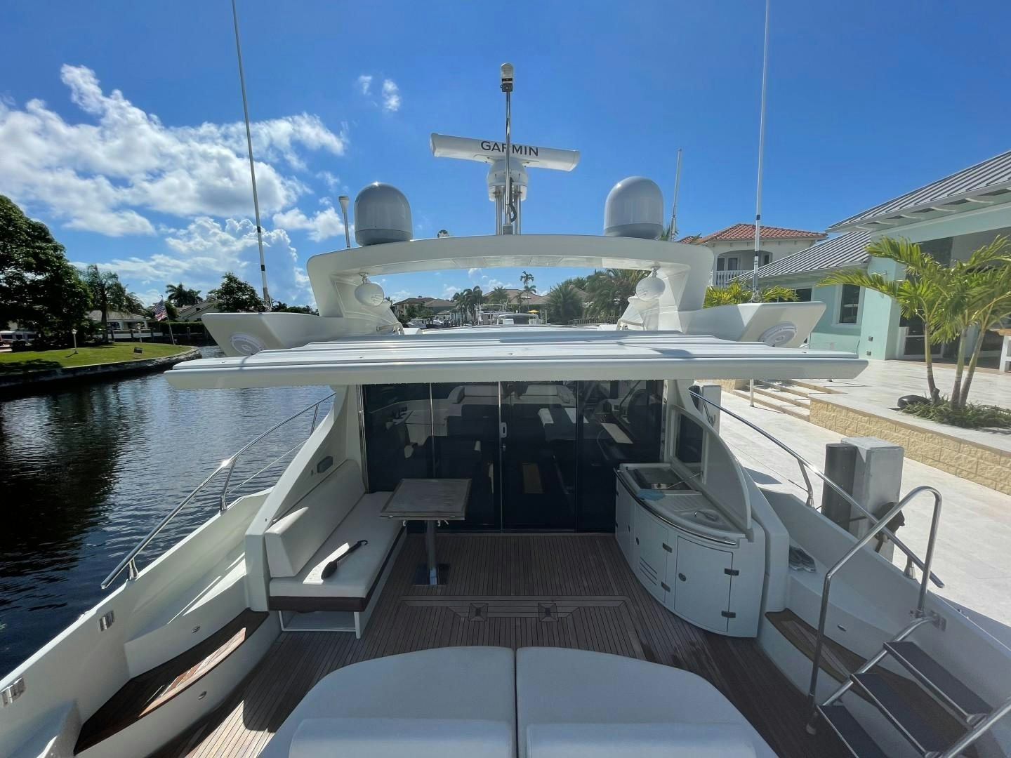 a large white boat with a cross on it aboard DV8 Yacht for Sale