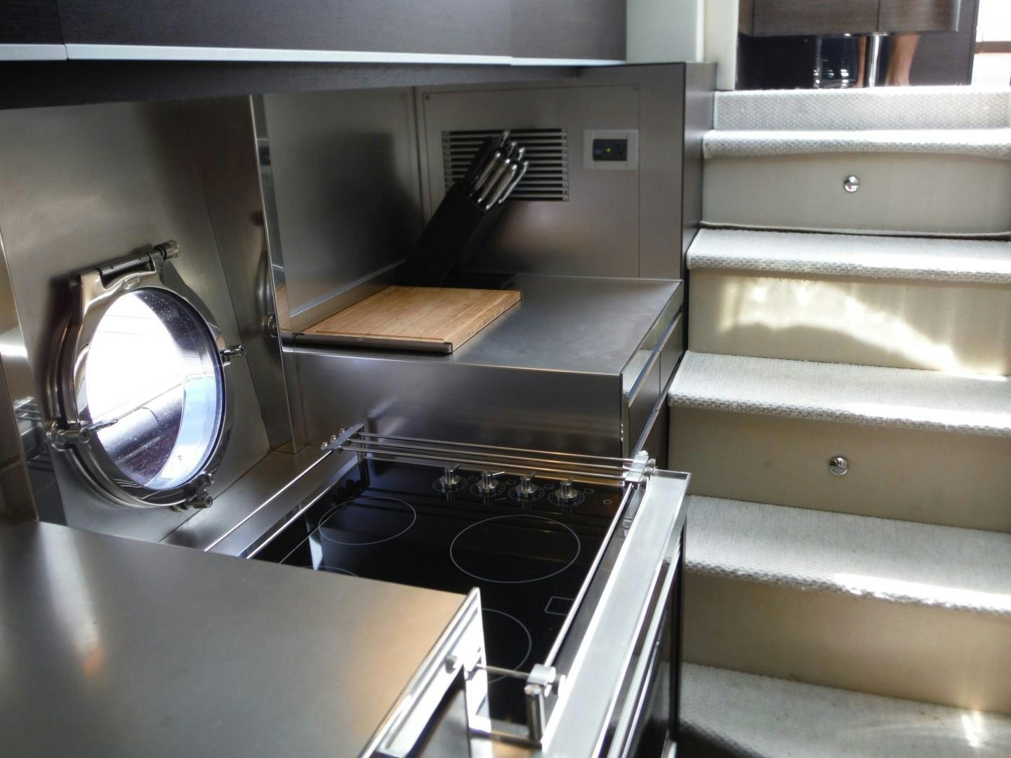 a kitchen with an oven and a stove aboard DV8 Yacht for Sale