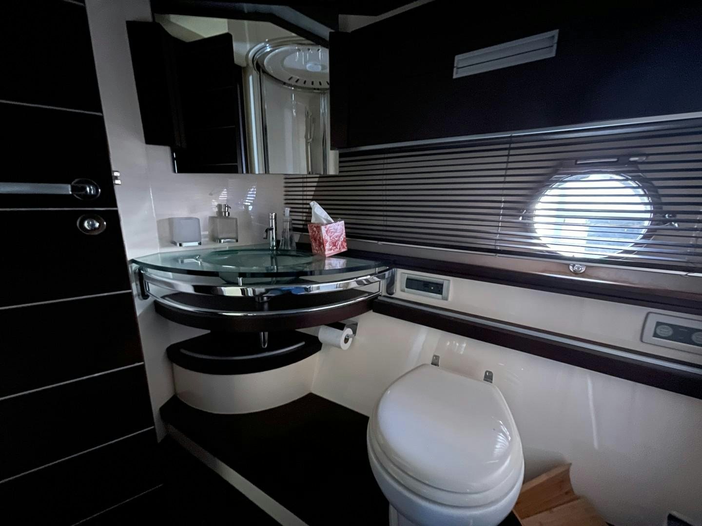 a bathroom with a sink and a toilet aboard DV8 Yacht for Sale