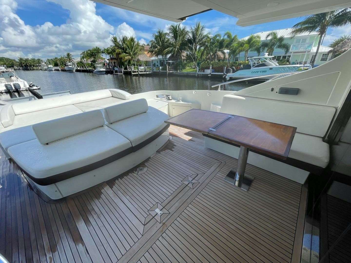 a deck with a pool and boats aboard DV8 Yacht for Sale