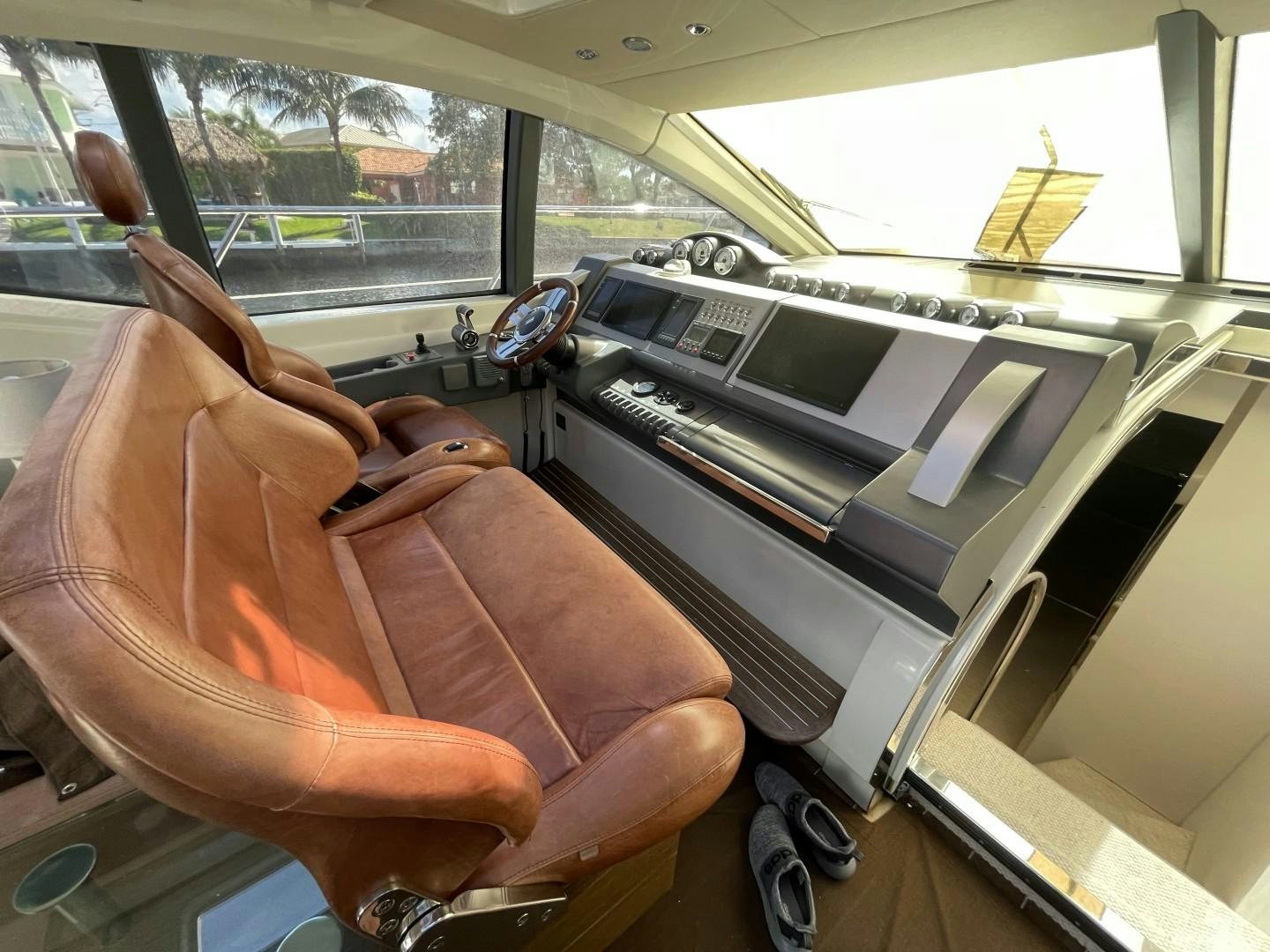 a person's legs and feet on a car aboard DV8 Yacht for Sale