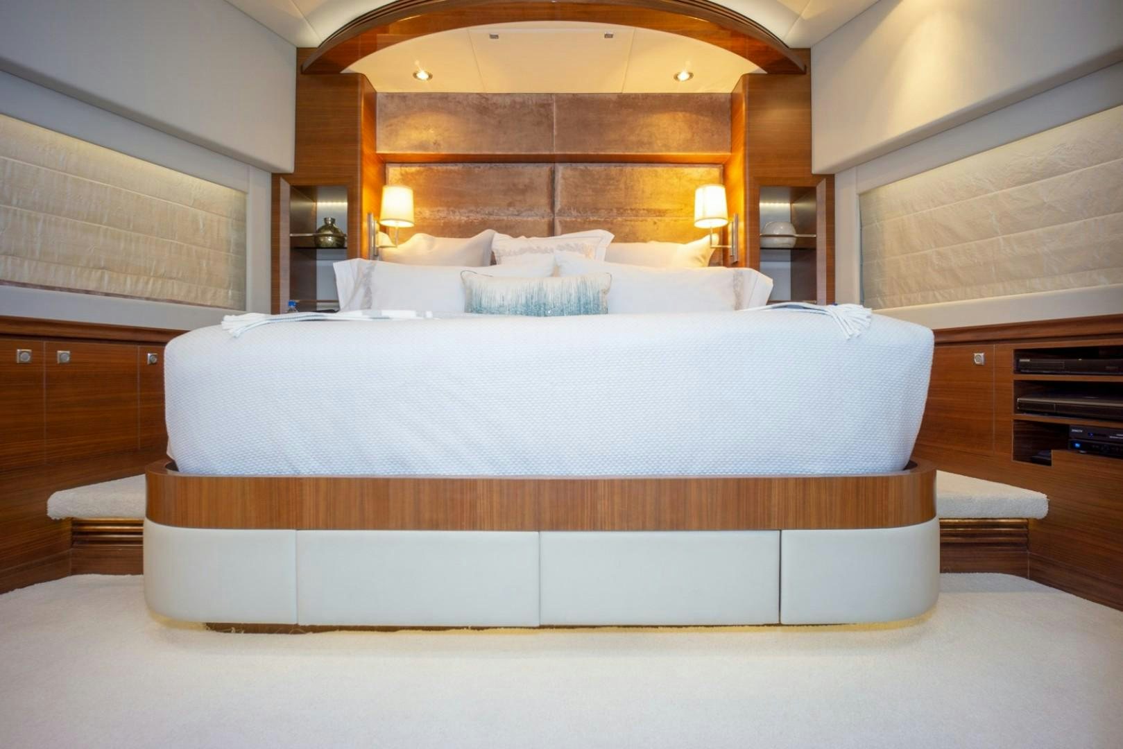 a bed with white sheets aboard IN THE ZONE Yacht for Sale