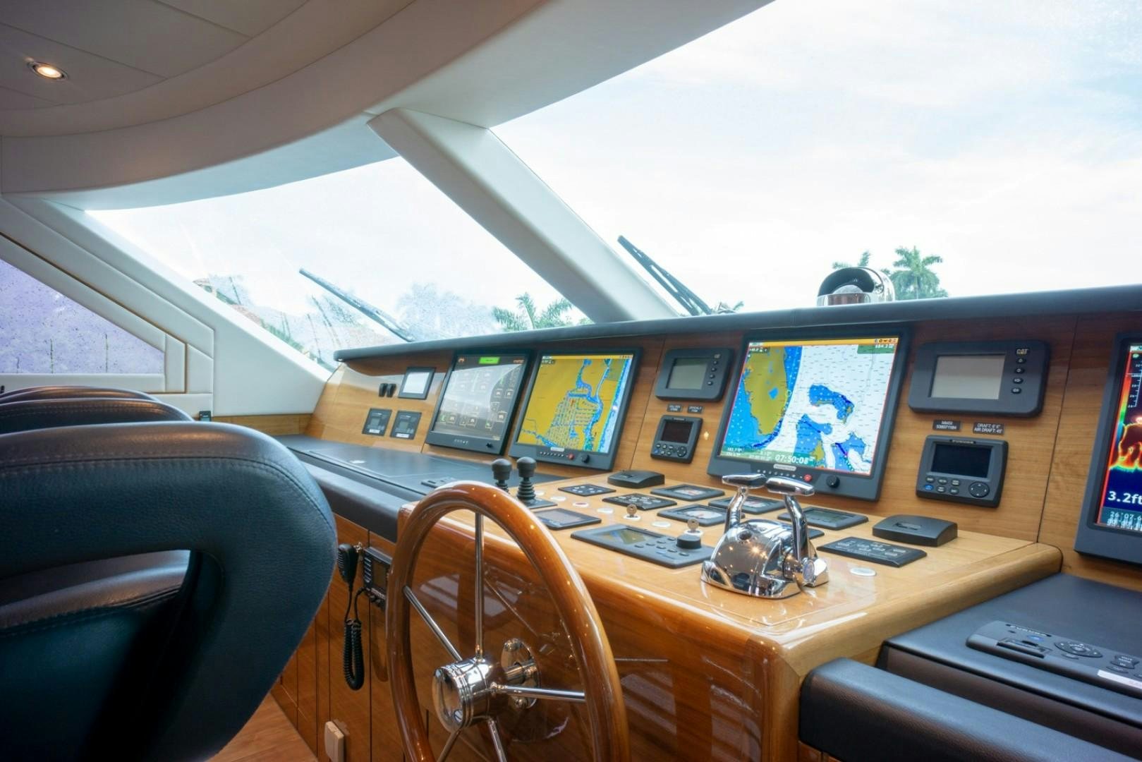 a car with multiple monitors and screens aboard IN THE ZONE Yacht for Sale