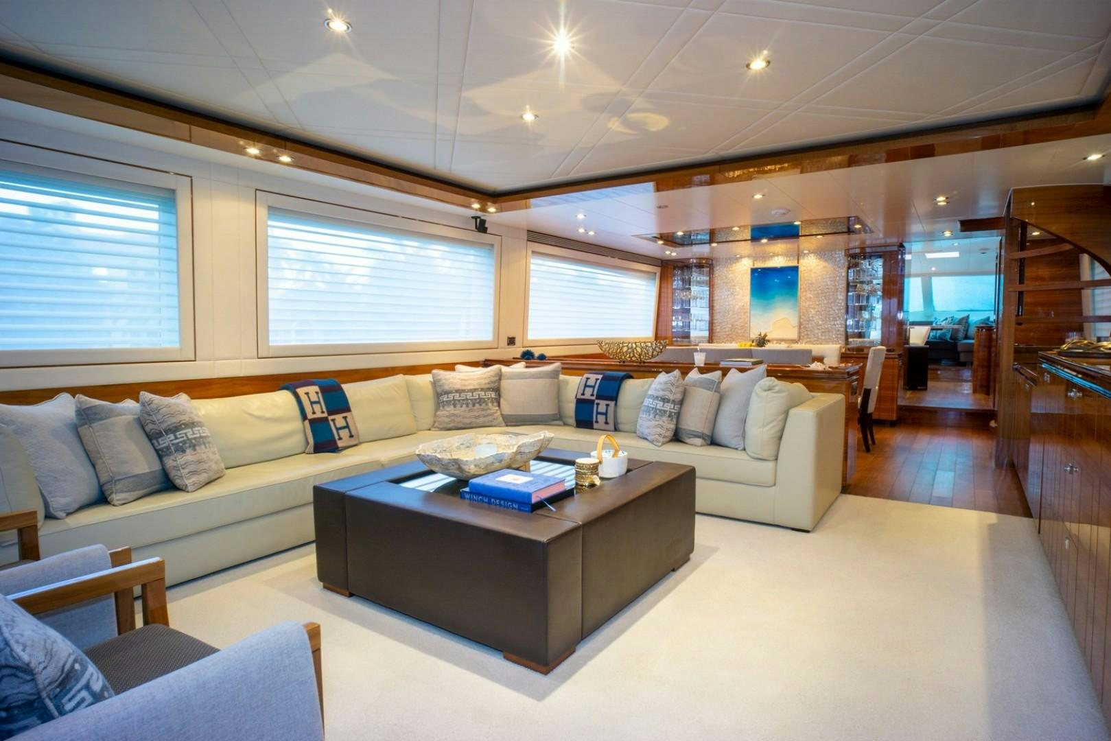 a living room with a couch and a table aboard IN THE ZONE Yacht for Sale