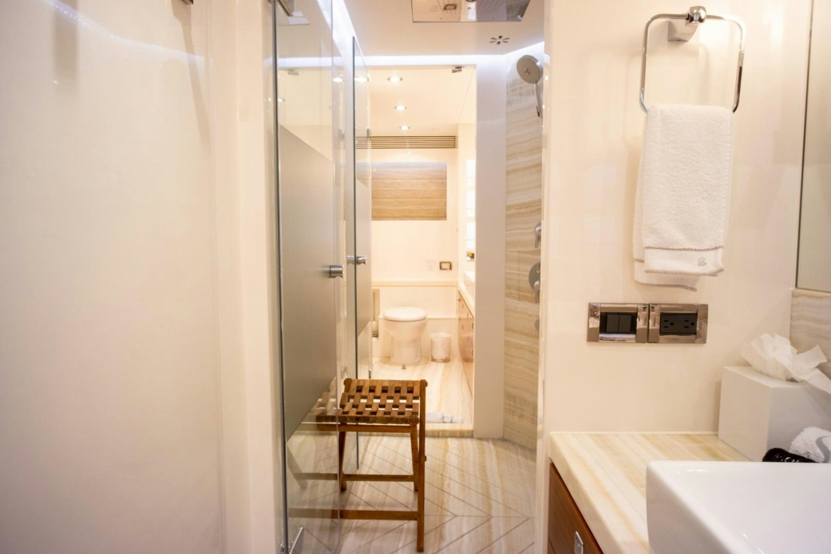 a bathroom with a stand up shower aboard IN THE ZONE Yacht for Sale
