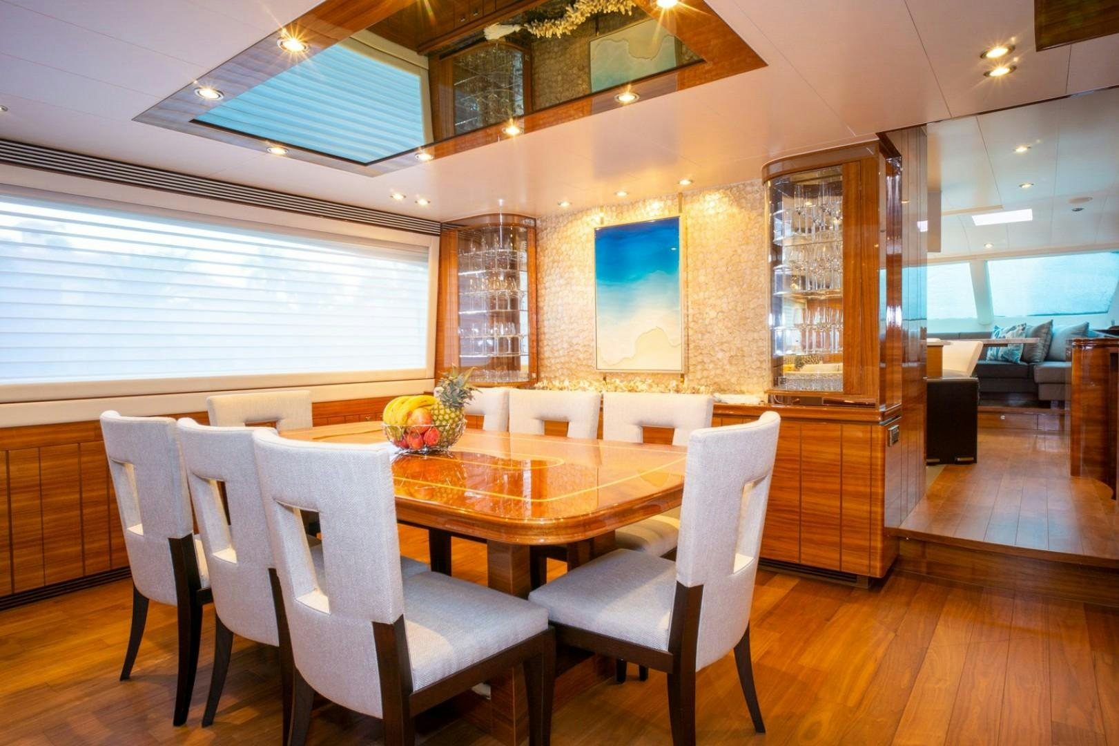 a room with a table chairs and a window aboard IN THE ZONE Yacht for Sale